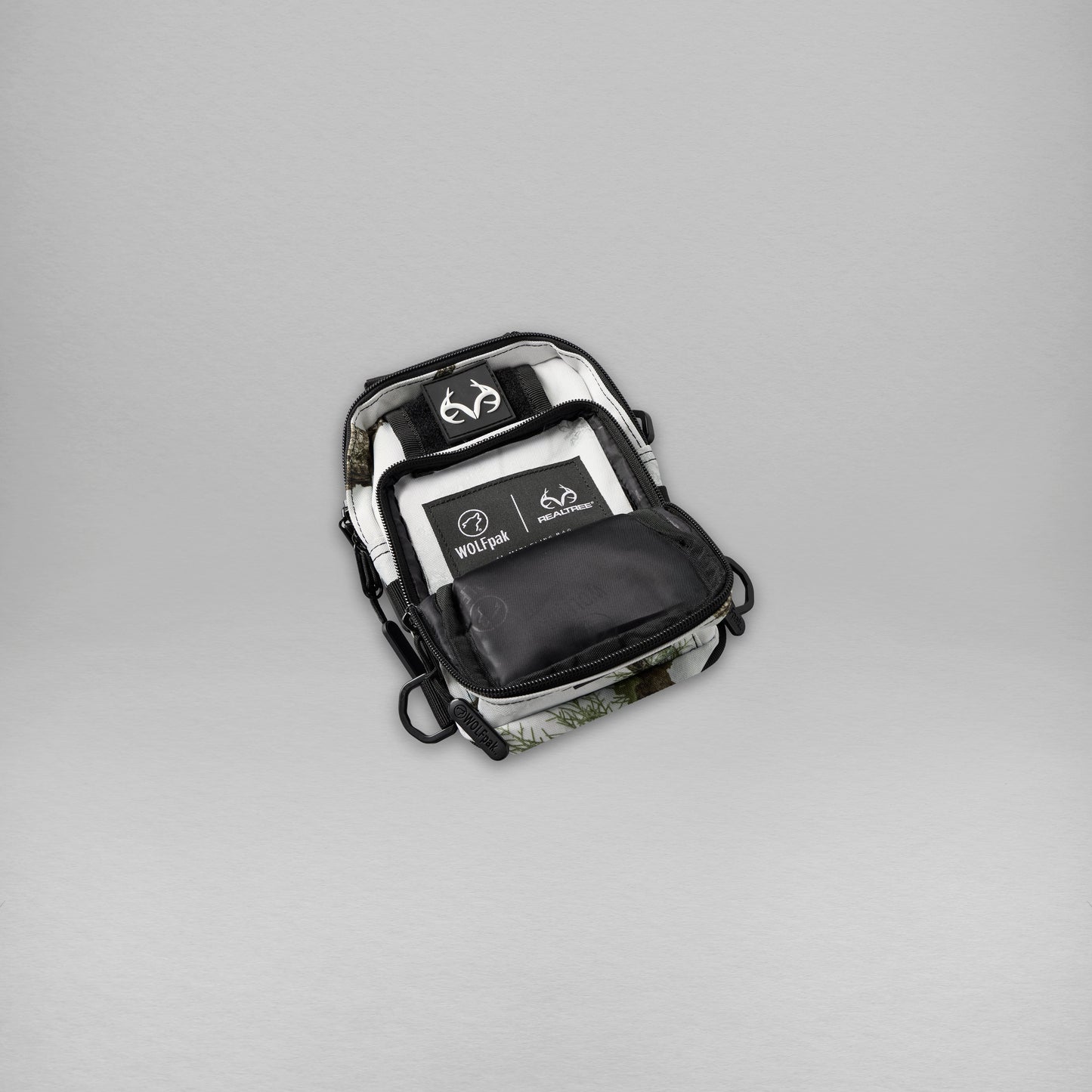Realtree WOLFpak 4L Mini Tactical Camo Sling Bag - Realtree APX Snow